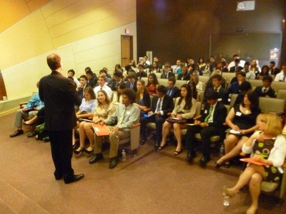 Maurice presenting to a college lecture hall