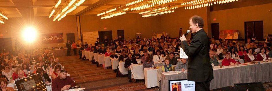 Maurice delivering a keynote to a full ballroom